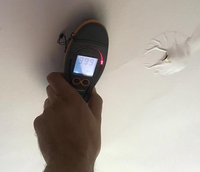 moisture meter on a ceiling