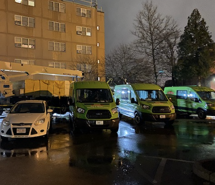 green trucks parked at night