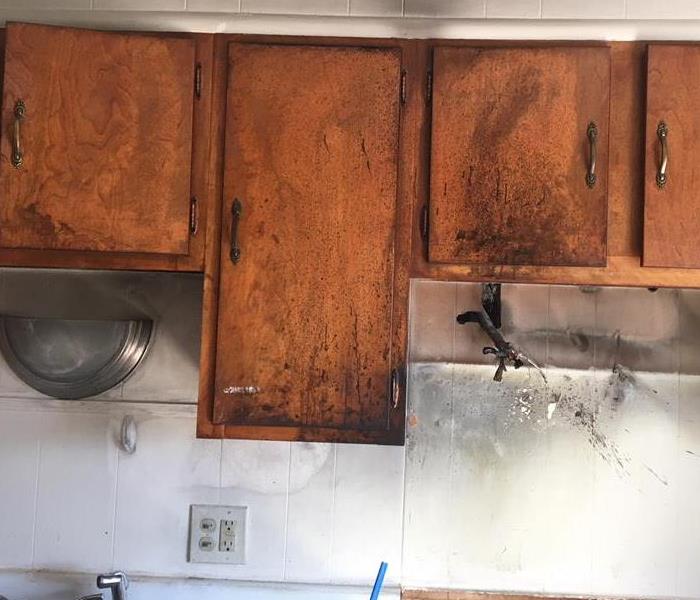 Fire damage to counters above stove.
