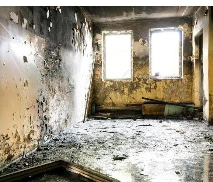 Empty room damaged by fire and soot damage